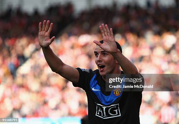 John O'Shea of Manchester Unted celebrates his goal during the Barclays Premier League match between Stoke City and Manchester United at the...