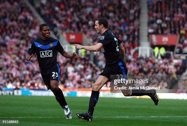 John O'Shea of Manchester Unted celebrates his goal during the Barclays Premier League match between Stoke City and Manchester United at the...