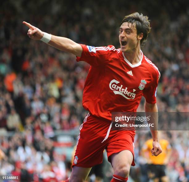 Albert Riera of Liverpool celebrates after scoring the final goal of the Barclays Premier League match between Liverpool and Hull City at Anfield on...