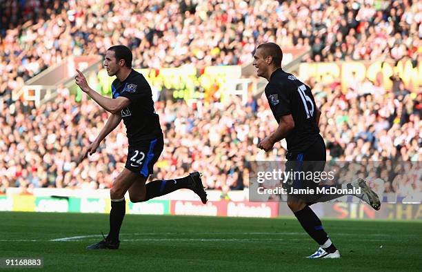 John O'Shea of Manchester Unted celebrates his goal during the Barclays Premier League match between Stoke City and Manchester United at the...