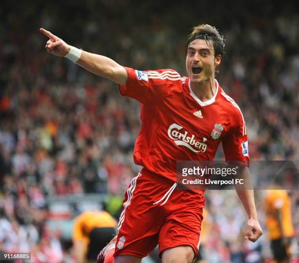 Albert Riera of Liverpool celebrates after scoring the final goal of the Barclays Premier League match between Liverpool and Hull City at Anfield on...