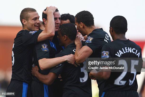 John O'Shea of Manchester United celebrates his goal with team mates during the Barclays Premier League match between Stoke City and Manchester...