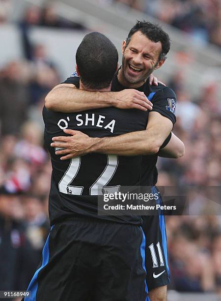 John O'Shea of Manchester United celebrates scoring their second goal during the Barclays FA Premier League match between Stoke CIty and Manchester...