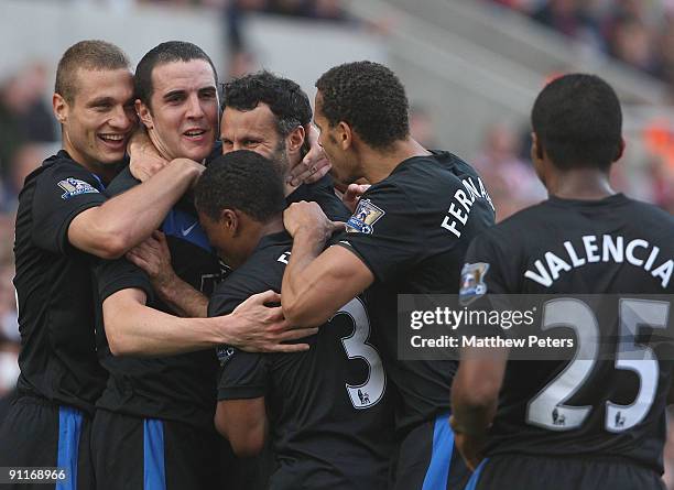 John O'Shea of Manchester United celebrates scoring their second goal during the Barclays FA Premier League match between Stoke CIty and Manchester...
