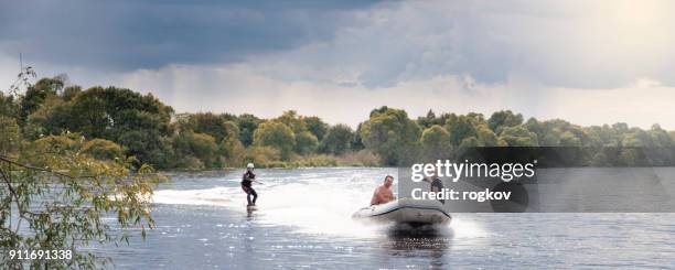 wakeboarding.a man trained on the water. - wakeboarding stock pictures, royalty-free photos & images