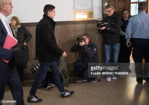 Borussia Dortmund's Spanish defender Marc Bartra leaves after he testified in the trial of Sergej W, a man suspected of detonating three bombs...