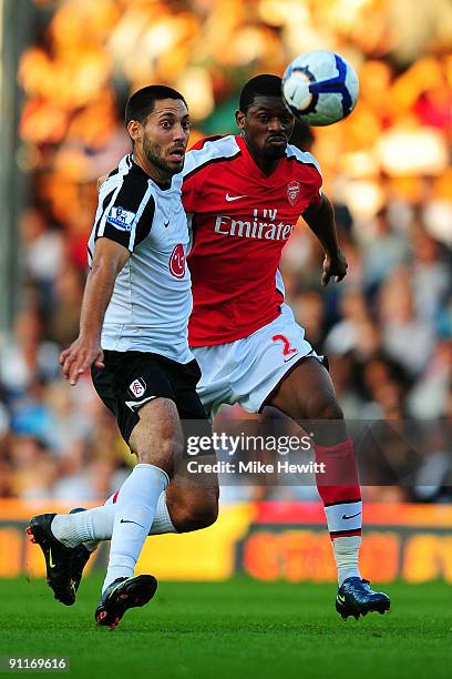 Zoltan Gera of Fulham battles for the ball with Clint Dempsey of Arsenal during the Barclays Premier League match between Fulham and Arsenal at...