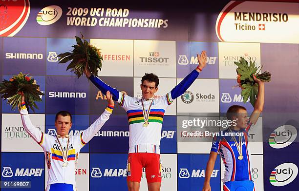 Betancur Gomez Carlos Alberto of Colombia, Romain Sicard of France and Egor Silin of Russian stand on the podium after the Men's Under 23 Road Race...