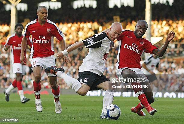 Fulham's English striker Andy Johnson vies with Arsenal's French defender William Gallas during the English Premier League football match between...