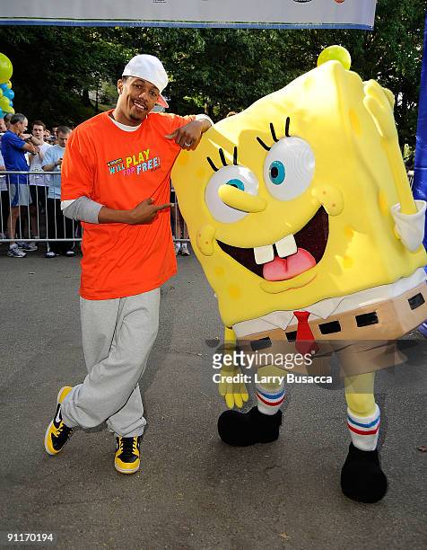 Nick Cannon poses with character Spongebob at Nickelodeon's Sixth Annual Worldwide Day of Play with NYC Big Brothers and Big Sisters at Riveride Park...