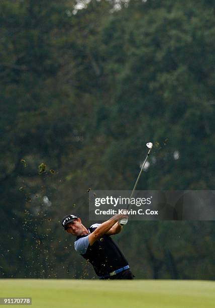 Padraig Harrington of Ireland plays his second shot from the eighth fairway during the third round of THE TOUR Championship presented by Coca-Cola,...