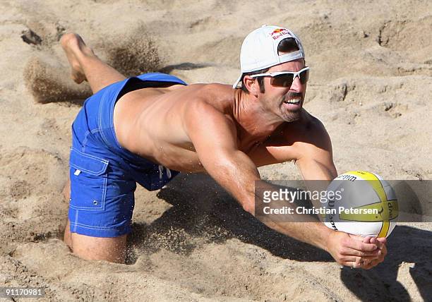 Todd Rogers of USA digs the ball during the round 3 match in the AVP Crocs Tour World Challenge against Brazil at the Westgate City Center on...