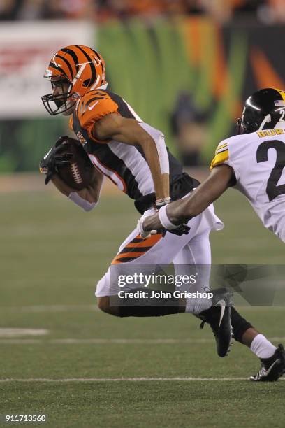 Josh Malone of the Cincinnati Bengals runs the football upfield during the game against the Pittsburgh Steelers at Paul Brown Stadium on December 4,...