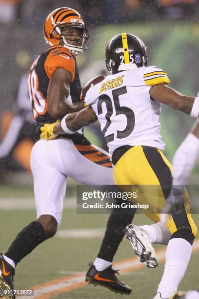 Green of the Cincinnati Bengals runs the football upfield against Artie Burns of the Pittsburgh Steelers during their game at Paul Brown Stadium on...