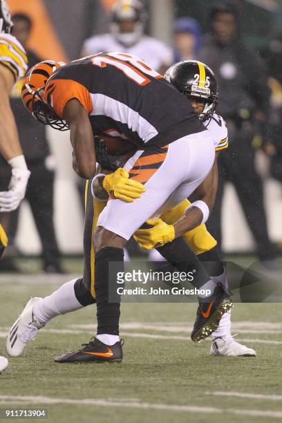 Green of the Cincinnati Bengals runs the football upfield against Artie Burns of the Pittsburgh Steelers during their game at Paul Brown Stadium on...