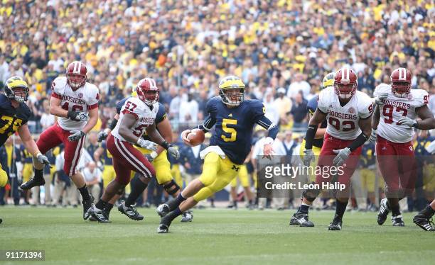 University of Michigan Quarterback Tate Forcier runs for a short gain late in the fourth quarter against the Indiana Hoosiers at Michigan Stadium on...