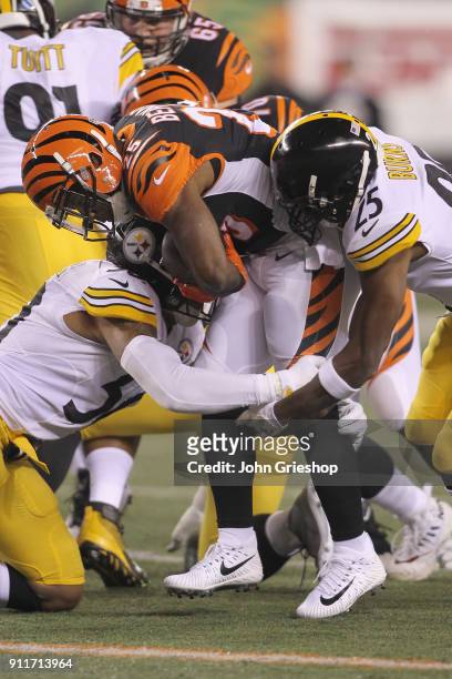 Giovani Bernard of the Cincinnati Bengals runs the football upfield against Ryan Shazier#50 of the Pittsburgh Steelers during their game at Paul...