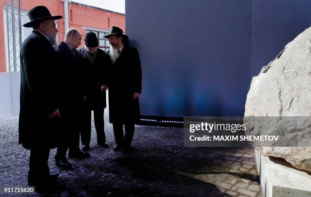 Russian President Vladimir Putin , accompanied by Alexander Boroda , head of the Russian Federation of Jewish Communities and the museums director,...