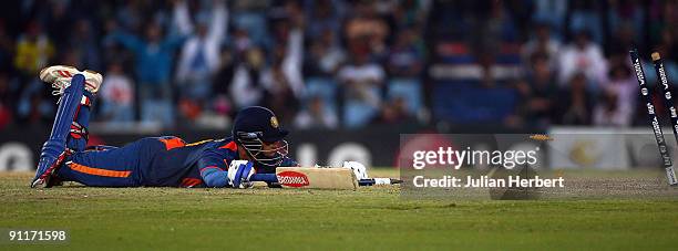 Raul Dravid unsucsessfully dives to avoid being stumped during The ICC Champions Trophy Group A Match between India and Pakistan on September 26,...