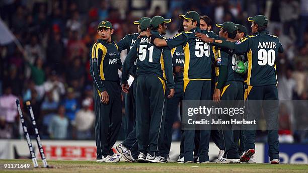 Pakistani players celebrate the dismissal of Raul Dravid during The ICC Champions Trophy Group A Match between India and Pakistan on September 26,...