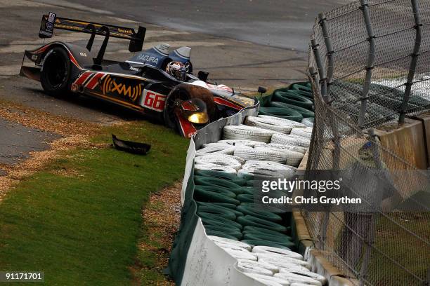 The de Ferran Motorsports Acura ARX-02a driven by Scott Dixon crashes into the barrier during the American Le Mans Series Petit Le Mans on September...