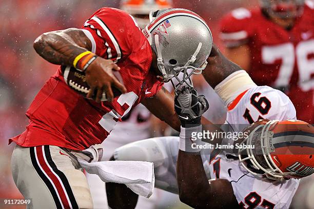 Defensive end Clay Nurse of the Illinois Fighting Illini hauls down quarterback Terrelle Pryor of the Ohio State Buckeyes by his facemask at Ohio...