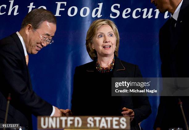 Secretary of State Hillary Clinton greets UN Secretary-General Ban Ki-moon and President of the Republic of Rwanda Paul Kagame speak at a meeting on...