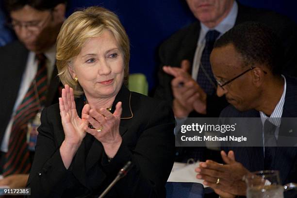 Secretary of State Hillary Clinton applauds President of the Republic of Rwanda Paul Kagame begins to speak at a meeting on food security at the...