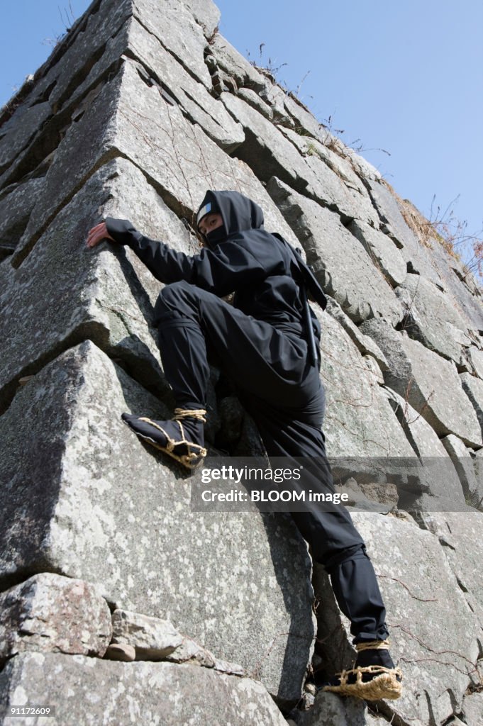 Ninja Falling Rocks Ninja Climbing Rock Wall High-Res Stock Photo - Getty Images