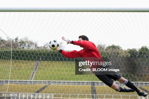 Goalkeeper Rushing Out Goalkeeper Jumping For Ball High-Res Stock Photo - Getty Images