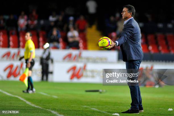 Robert Dante Siboldi Head Coach of Santos holds the ball during the 4th round match between Veracruz and Santos Laguna as part of the Torneo Clausura...