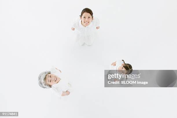 grandmother, mother and granddaughter, view from above - japanese woman looking up stock pictures, royalty-free photos & images