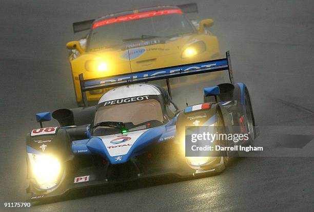 Stephane Sarrazin drives the LMP1 Team Peugeot Total Peugeot 908 HDI during the American Le Mans Series Petit Le Mans on September 26, 2009 at Road...