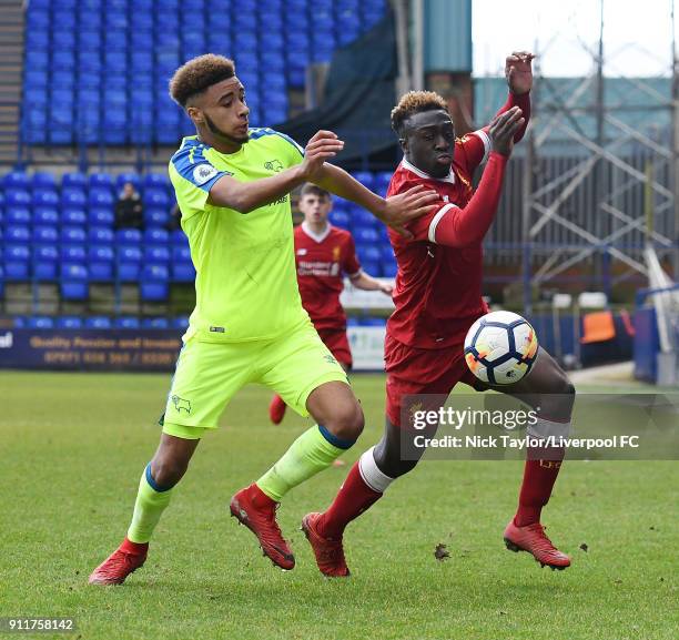 Bobby Adekanye of Liverpool competes with Jayden Bogle of Derby County during a Premier League 2 match between Liverpool and Derby County at Prenton...