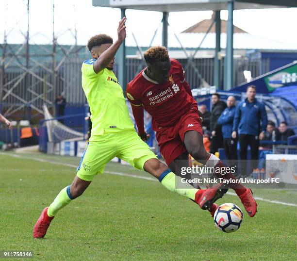 Bobby Adekanye of Liverpool competes with Jayden Bogle of Derby County during the Premier League 2 match between Liverpool and Derby County at...