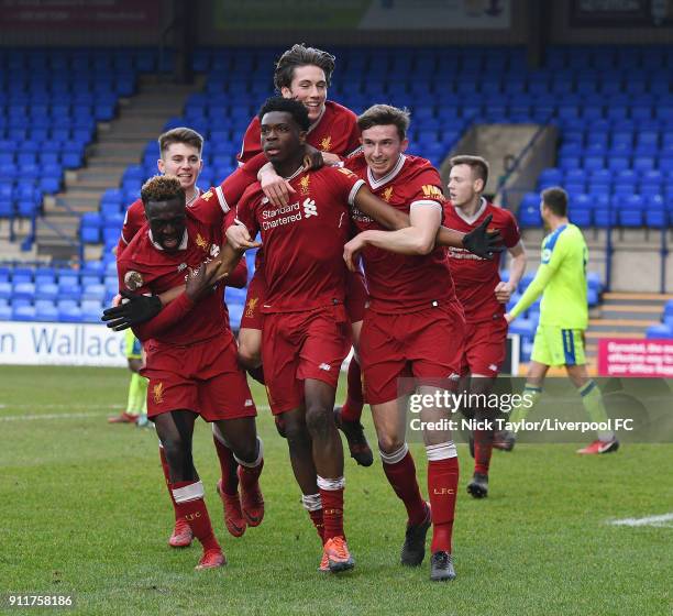 Ovie Ejaria of Liverpool celebrates with his team mates after scoring the opening goal during the Premier League 2 match between Liverpool and Derby...