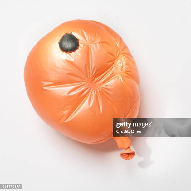 flat balloon repaired with bicycle patchs - provisorisch stockfoto's en -beelden