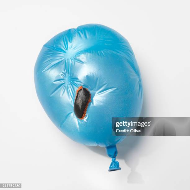 flat balloon repaired with bicycle patchs - makeshift fix stock pictures, royalty-free photos & images