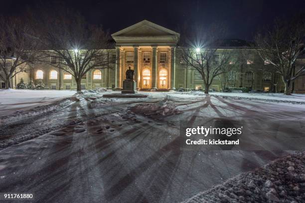 cornell university in der nacht im winter - cornell university stock-fotos und bilder