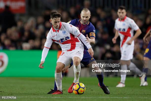 Alvaro Medran of Deportivo Alaves, Andries Iniesta of FC Barcelona during the La Liga Santander match between FC Barcelona v Deportivo Alaves at the...