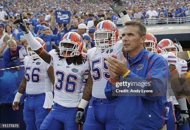 Head coach Urban Meyer of the Florida Gators waits to take the field with his team before the game against the Kentucky Wildcats at Commonwealth...