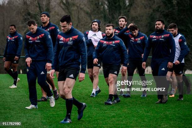 France's players arrive for a training session on January 29, 2018 at the team's training camp in Marcoussis, south of Paris, ahead of the Six...