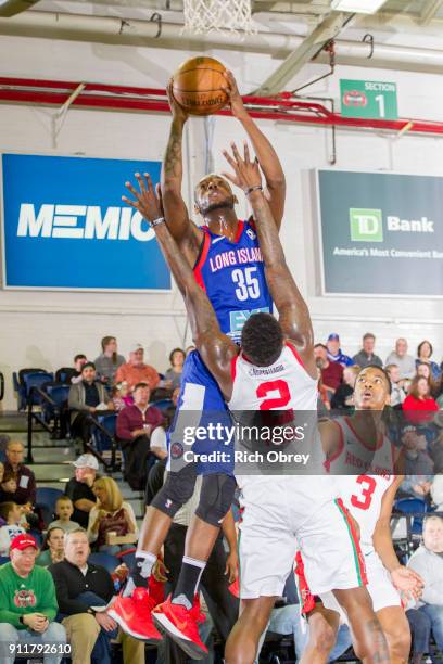 Milton Doyle of the Long Island Nets shoots over L.J. Peak of the Maine Red Claws on Sunday, January 28, 2018 at the Portland Expo in Portland,...