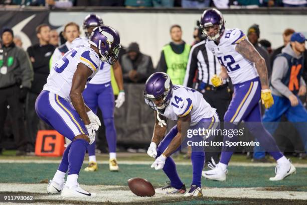 Minnesota Vikings tight end Kyle Rudolph celebrates with Minnesota Vikings wide receiver Stefon Diggs by pretending to play a game of Curling with...