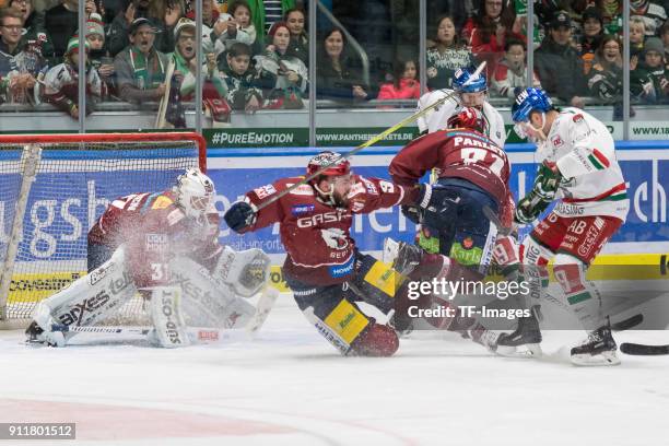 Goalkeeper Patrick Vehanen of Eisbaeren Berlin, Constantin Braun of Eisbaeren Berlin, Blake Parlett of Eisbaeren Berlin and Drew LeBlanc of...