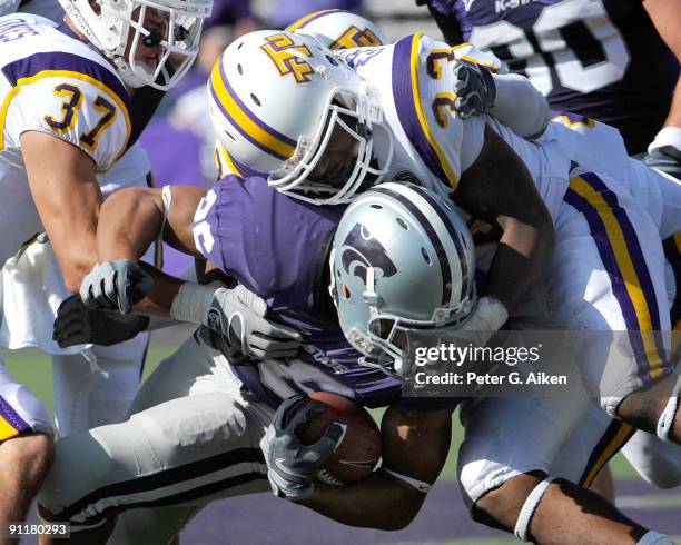 Linebacker Howard Griffin of the Tennessee Tech Golden Eagles wraps up running back Jarell Childs of the Kansas State Wildcats during the fourth...