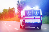 Ambulance van on highway with flashing lights