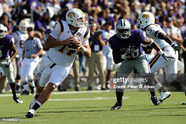 Quarterback Lee Sweeney of the Tennessee Tech Golden Eagles rolls out on a pass play against the Kansas State Wildcats during the second quarter at...