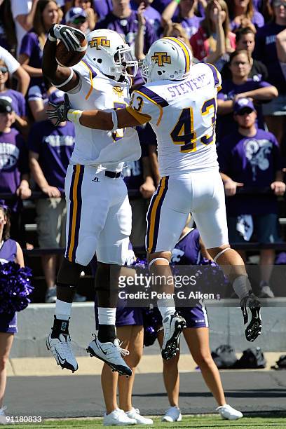 Tight end Jamere Hogue of the Tennessee Tech Golden Eagles celebrates with teammate Charlie Stevens after scoring on a 19 yard touchdown pass against...