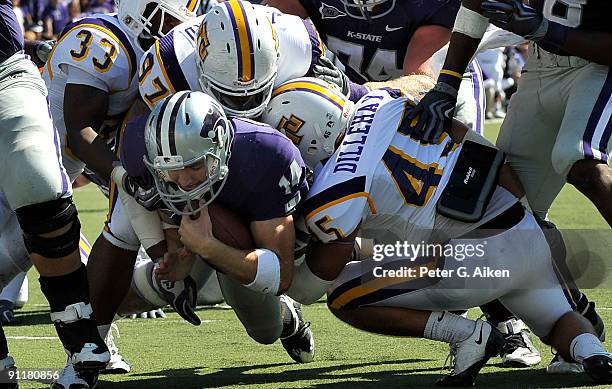 Quarterback Carson Coffman of the Kansas State Wildcats dives across the goal line on a five yard touchdown run against the Tennessee Tech Golden...